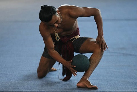 A player warms up prior to an ulama championship match, a traditional ballgame with roots in Mesoamerican culture, in Mexico City.