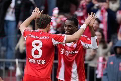 Bayern's Leon Goretzka and Nicolas Jackson celebrate after scoring during a Bundesliga soccer match between Bayern and Stuttgart in Munich, Germany.