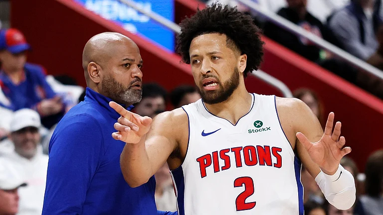 Detroit Pistons guard Cade Cunningham (2) discusses a play with Detroit Pistons head coach J.B. Bickerstaff, left, during the first half in Game 1 against the Orlando Magic in a first-round NBA basketball playoffs series Sunday, April 19, 2026, in Detroit. - | Photo: AP/Duane Burleson