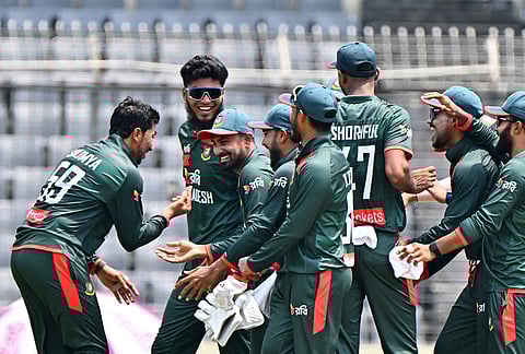 Bangladesh's Soumya Sarkar, left, celebrating the wicket of New Zealand's captain Tom Latham during the second one day international cricket match between Bangladesh and New Zealand in Mirpur, Bangladesh.