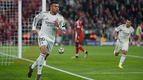 Real Madrid's Kylian Mbappe celebrates after scoring his side's third goal during the Champions League quarterfinal second leg soccer match between Bayern Munich and Real Madrid in Munich, Germany, Wednesday, April 15, 2026.