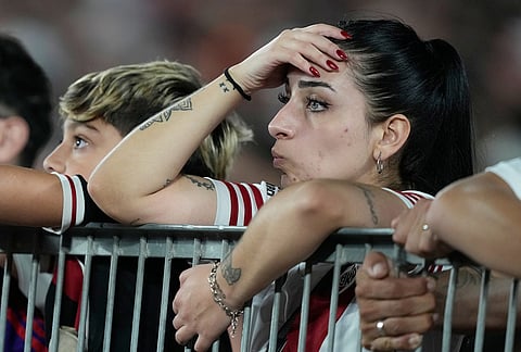 River Plate fans watch from the stands an Argentine league match against Boca Juniors in Buenos Aires, Argentina.