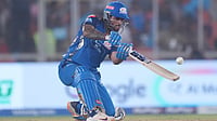 Ajit Solanki : Mumbai Indians' Tilak Verma hits a six during the Indian Premier League cricket match between Gujarat Titans and Mumbai Indians in Ahmedabad,