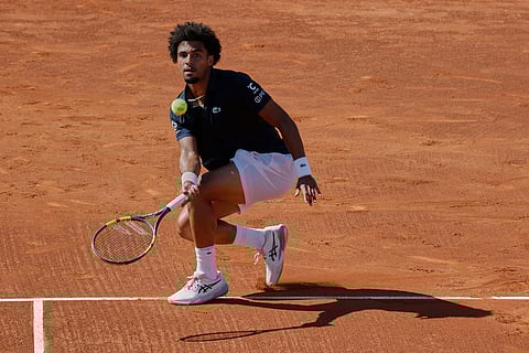 France's Arthur Fils returns the ball to Russia's Andrey Rublev during the ATP Barcelona Open tennis final in Barcelona, Spain.