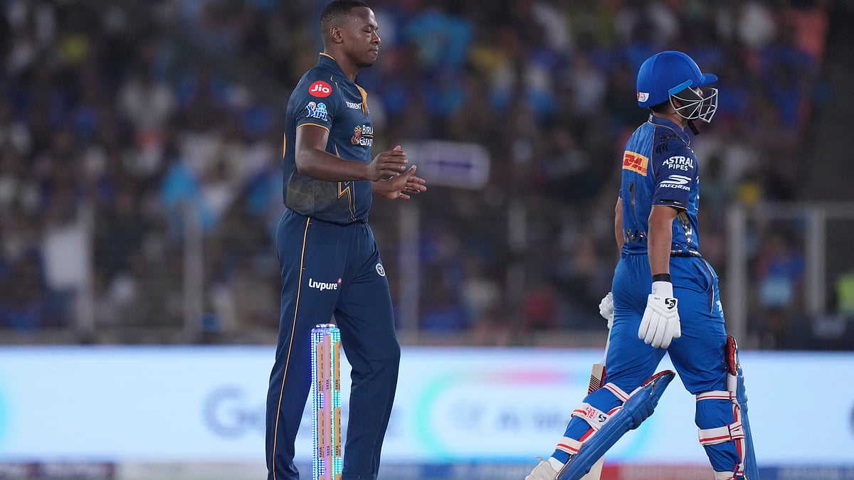 Gujarat Titans' Kagiso Rabada, left, celebrates the wicket of Mumbai Indians' Danish Malewar, right, during the Indian Premier League cricket match between Gujarat Titans and Mumbai Indians in Ahmedabad, India, Monday, April 20, 2026. - | Photo: AP/Ajit Solanki