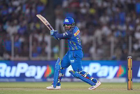 Mumbai Indian's Quinton de Kock plays a shot during the Indian Premier League cricket match between Gujarat Titans and Mumbai Indians in Ahmedabad.