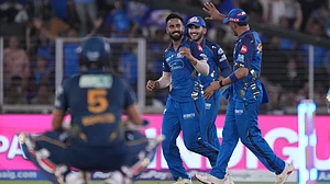 AP Photo : Naman Dhir celebrating after taking the catch of Washington Sundar during GT vs MI IPL 2026 match at Narendra Modi Stadium in Ahmedabad.