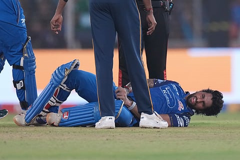 Tilak Varma down after being hit on the box during GT vs MI IPL 2026 clash.