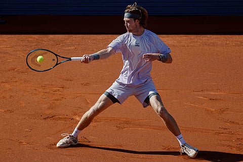 Russia's Andrey Rublev returns the ball to France's Arthur Fils during the ATP Barcelona Open tennis final in Barcelona, Spain.