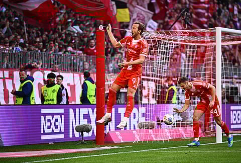 Bayern's Harry Kane celebrates after scoring a goal during a Bundesliga soccer match between Bayern and Stuttgart in Munich, Germany.
