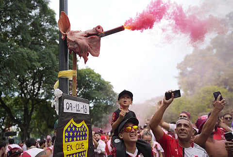 River Plate fans take photos of a pig's head representing archrival Boca Juniors ahead of an Argentine league match in Buenos Aires, Argentina.