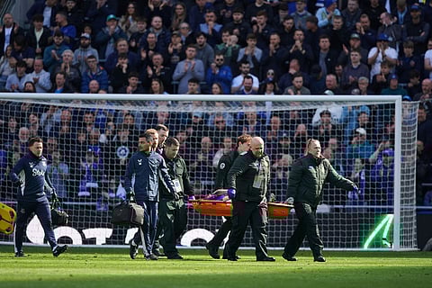 Everton's Jarrad Branthwaite is carried off injured during the English Premier League soccer match between Everton and Liverpool in Liverpool, England.