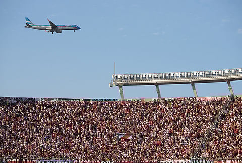 A commercial jetliner approaches Jorge Newbery Airport during an Argentine league match between River Plate and Boca Juniors at the Monemuntal stadium in Buenos Aires, Argentina.