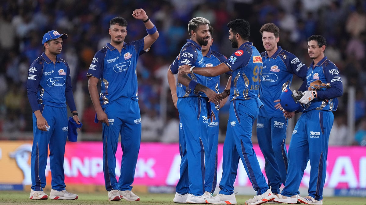 Mumbai Indians' players celebrates after winning the match the Indian Premier League cricket match against Gujarat Titans in Ahmedabad. - AP Photo