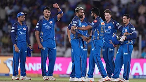 AP Photo : Mumbai Indians' players celebrates after winning the match the Indian Premier League cricket match against Gujarat Titans in Ahmedabad.
