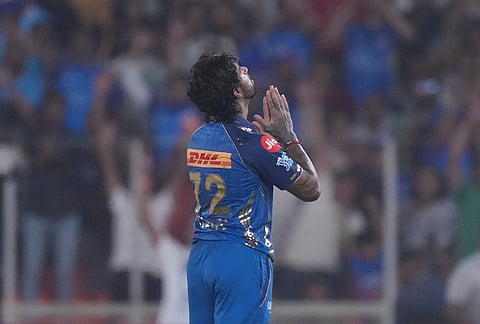 Mumbai Indians' Tilak Verma celebrates his century during the Indian Premier League cricket match between Gujarat Titans and Mumbai Indians in Ahmedabad.
