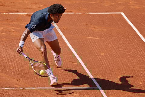 France's Arthur Fils returns the ball to Russia's Andrey Rublev during the ATP Barcelona Open tennis final in Barcelona, Spain.