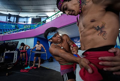 Players prepare for an ulama championship match, a traditional ballgame with roots in Mesoamerican culture, in Mexico City.