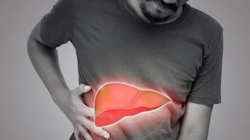 Man holding his side with a glowing red illustration of an inflamed liver overlaid on his abdomen