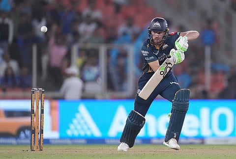 Gujarat Titans' Jos Buttler plays a shot during the Indian Premier League cricket match between Gujarat Titans and Mumbai Indians in Ahmedabad.