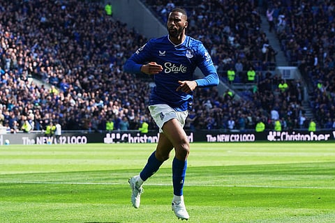 Everton's Beto celebrates scoring his side's first goal during the English Premier League soccer match between Everton and Liverpool in Liverpool, England.