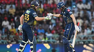 | Photo: AP/STR : Gujarat Titans' Jos Buttler congratulates captain Shubman Gill after his fifty runs during the Indian Premier League cricket match between Gujarat Titans and Lucknow Super Giants in Lucknow, India.