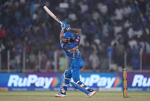 Mumbai Indians' Tilak Verma plays a shot during the Indian Premier League cricket match between Gujarat Titans and Mumbai Indians in Ahmedabad.