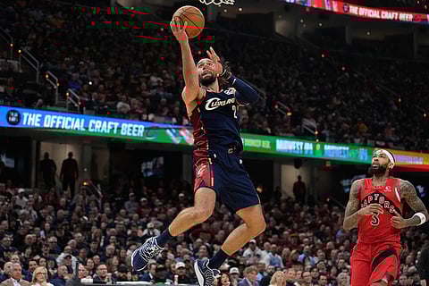 Cleveland Cavaliers guard Max Strus (2) shoots in front of Toronto Raptors forward Brandon Ingram (3) in the second half in Game 2 of a first-round NBA basketball playoffs series in Cleveland.