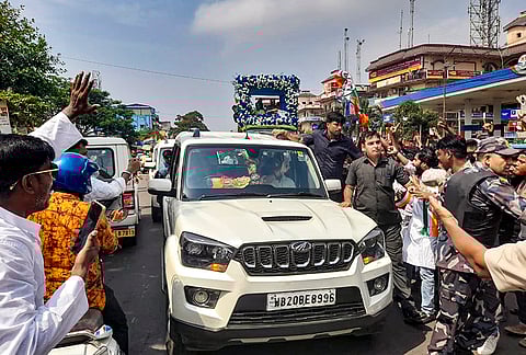 BJP candidate Dilip Ghosh’s convoy passes a TMC roadshow where the party’s campaigner and MP Yusuf Pathan (in background) hits the roads of Kharagpur in support of candidate Pradip Sarkar, in Kharagpur, West Bengal. 