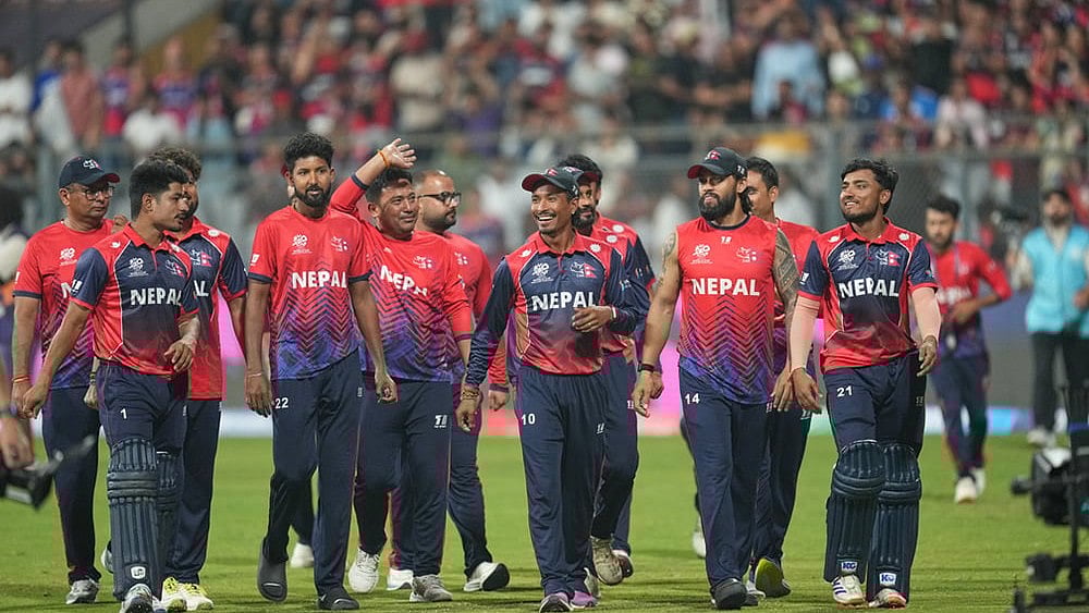 Nepal cricket team walks back to the pavilion after defeating Scotland during the T20 World Cup cricket match in Mumbai. - | Photo: AP/Rafiq Maqbool