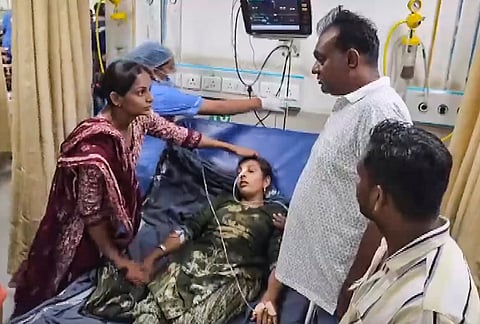 A sick person receives medical treatment at a hospital after suspected food poisoning at a wedding, in Dahod's Abhlod village, Gujarat.