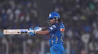 | Photo: AP/Ajit Solanki : Mumbai Indians' Tilak Verma hits a six during the Indian Premier League cricket match between Gujarat Titans and Mumbai Indians in Ahmedabad.