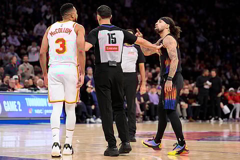 New York Knicks guard Jose Alvarado, right, argues with Atlanta Hawks guard CJ McCollum (3) during the second half in Game 2 of a first-round NBA playoffs basketball series in New York.