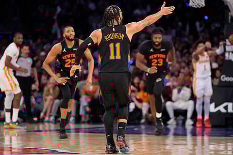 New York Knicks guard Jalen Brunson (11) reacts after scoring a three point goal during the second half in Game 2 of a first-round NBA playoffs basketball series against the Atlanta Hawks  in New York.