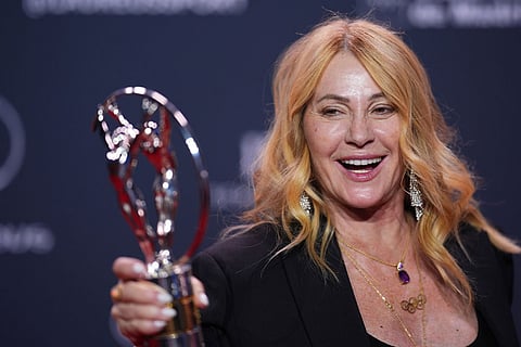 Retired Romanian gymnast Nadia Comaneci poses with with the Lifetime Achievement Award during the 2026 Laureus World Sports Awards ceremony in Madrid, Spain.