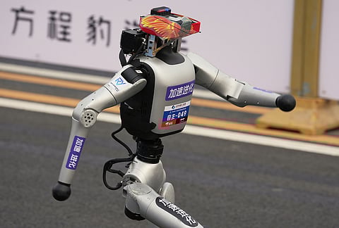 A robot starts off for the Beijing E-Town Half Marathon and Humanoid Half Marathon on the outskirts of Beijing.
