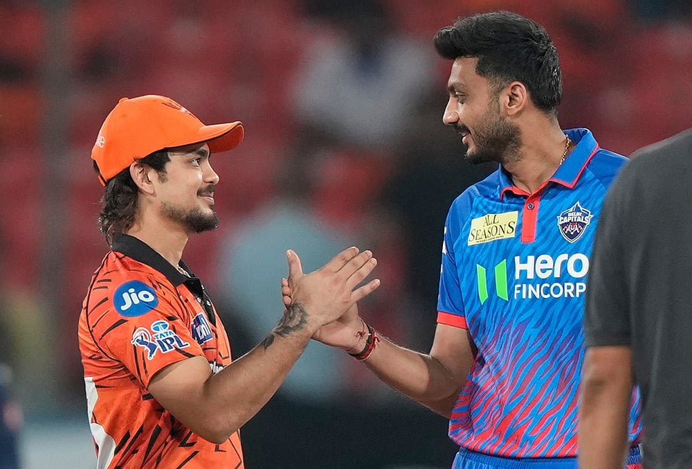 Sunrisers Hyderabad's captain Ishan Kishan, left, and Delhi Capitals' captain Axar Patel, shake hands after toss during the Indian Premier League cricket match between Sunrisers Hyderabad and Delhi Capitals in Hyderabad. - | Photo: AP/Mahesh Kumar A.