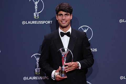 Carlos Alcaraz poses with his Laureus World Sportsman of the Year award during the 2026 Laureus World Sports Awards ceremony in Madrid, Spain.