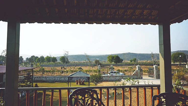 Green Step Farms by Ram Rattan Group in Naugaon, a nature-centric farmhouse community set amid the Aravalli landscape. - null