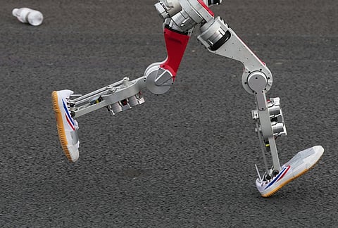 A robot starts off for the Beijing E-Town Half Marathon and Humanoid Half Marathon on the outskirts of Beijing.