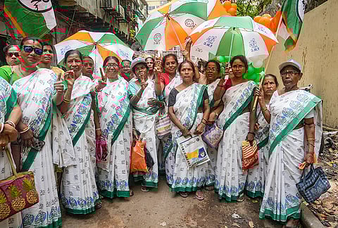 Trinamool Congress (TMC) supporters gather during a roadshow led by party candidate from Jorasanko constituency, Vijay Upadhyay, unseen, ahead of the West Bengal Assembly elections, in Kolkata.