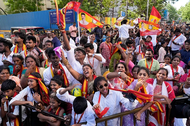 TVK supporters gather during a roadshow led by party chief and candidate from the Tiruchirappalli East constituency, Vijay, ahead of the Tamil Nadu Assembly elections. - | Photo: Suresh K Pandey/OUTLOOK