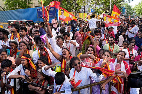 TVK supporters gather during a roadshow led by party chief and candidate from the Tiruchirappalli East constituency, Vijay, ahead of the Tamil Nadu Assembly elections. 