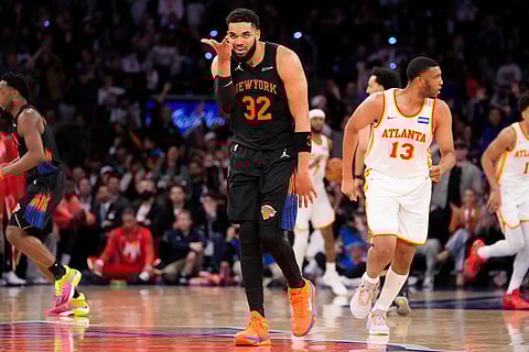New York Knicks center Karl-Anthony Towns (32) reacts after scoring a 3-point goal during the second half in Game 2 of a first-round NBA playoffs basketball series against the Atlanta Hawks  in New York.
