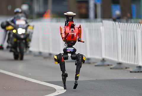 A humanoid robot runs in the Beijing E-Town Half Marathon and Humanoid Half Marathon on the outskirts of Beijing.
