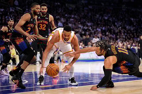 Atlanta Hawks guard CJ McCollum (3) fights for control of the ball with New York Knicks guard Jalen Brunson (11) during the second half in Game 2 of a first-round NBA playoffs basketball series in New York.
