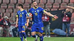 | Photo: AP/Armin Durgut : Bosnia's Ermedin Demirovic celebrates after Bosnia's Haris Tabakovic scored his side's first goal during the World Cup qualifying playoff final soccer match between Bosnia and Italy in Zenica, Bosnia.