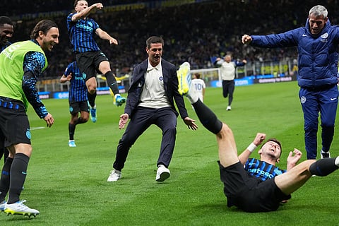 Inter Milan's head coach Cristian Chivu, center,  celebrates after Inter Milan's Petar Sucic scored his side's third goal during the Italian Cup, return-leg soccer match between Inter Milan and Como, in Milan, Italy.
