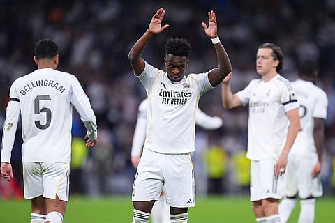 Real Madrid's Vinicius Junior reacts after scoring during a La Liga soccer match between Real Madrid and Alaves in Madrid, Spain.