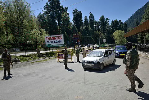 Security personnel conducting their routine check on the roadsides in Pahalgam.
